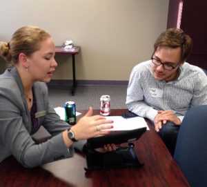Person demonstrating apps on iPad