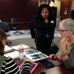 Person demonstrating apps on iPad