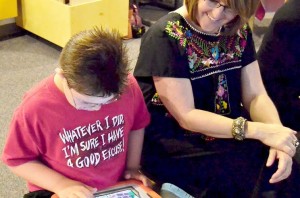 woman and child with iPad