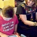 woman and child with iPad