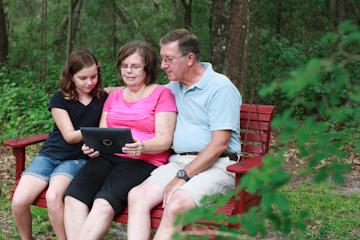 family looking at ipad