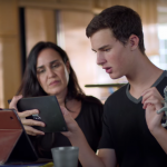 White woman helping young adult DillaniPad