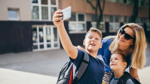 mom and 2 boys taking selfie