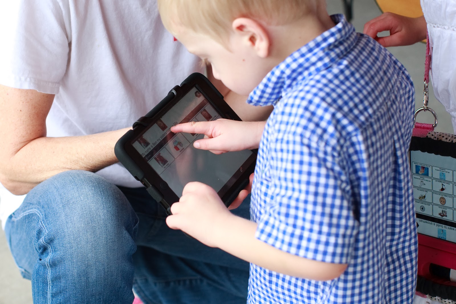 young boy using ipad
