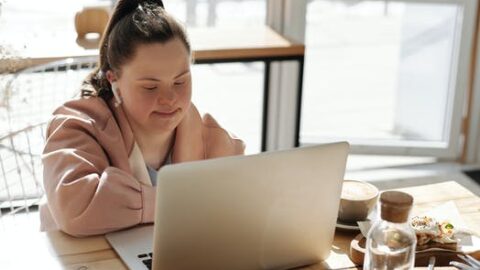 young adult with laptop