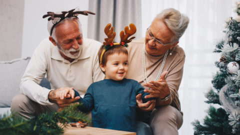 older adult couple with grandchild