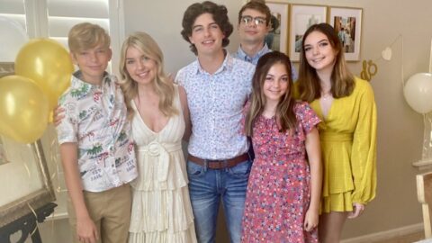 6 young adults posing and smiling at the camera