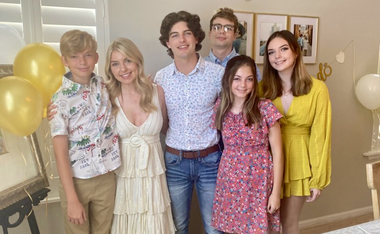 6 young adults posing and smiling at the camera