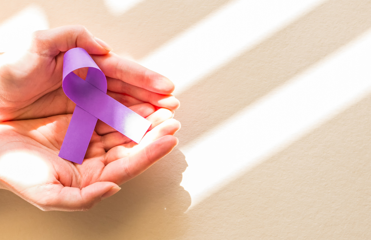 purple epilepsy ribbon in hands