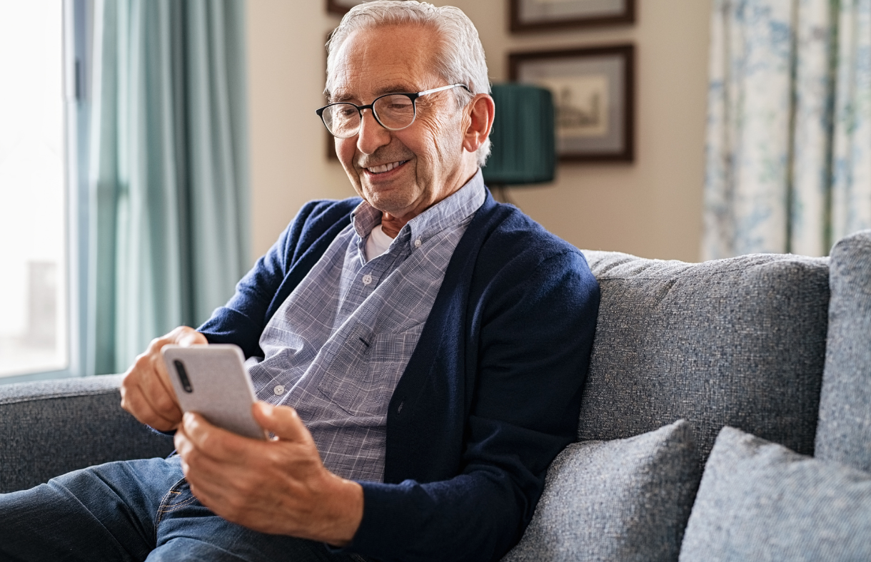 older adult man using smartphone