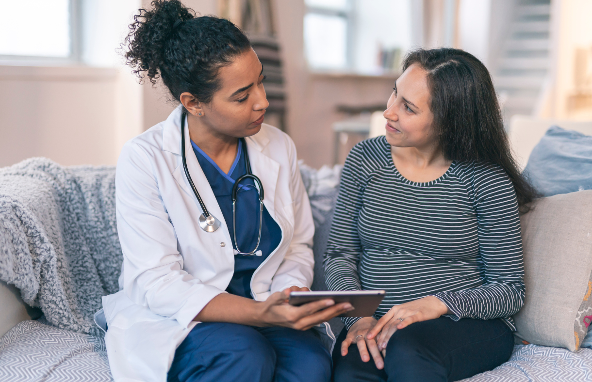 pregnant lady speaking with doctor