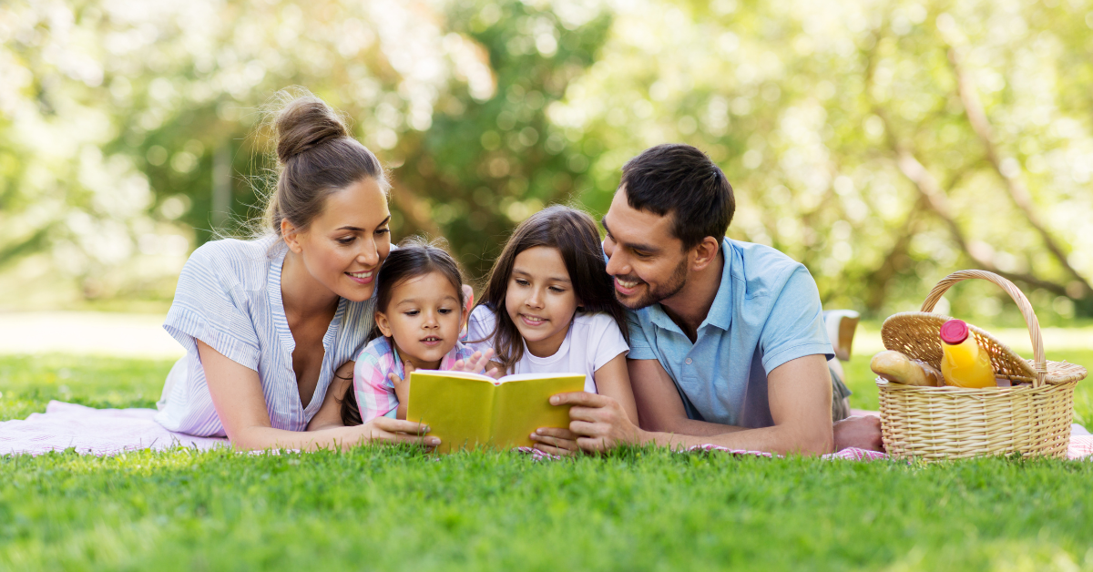 family reading outside