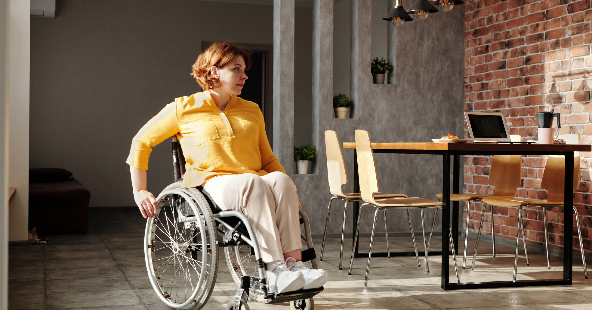 woman in wheelchair in home kitchen