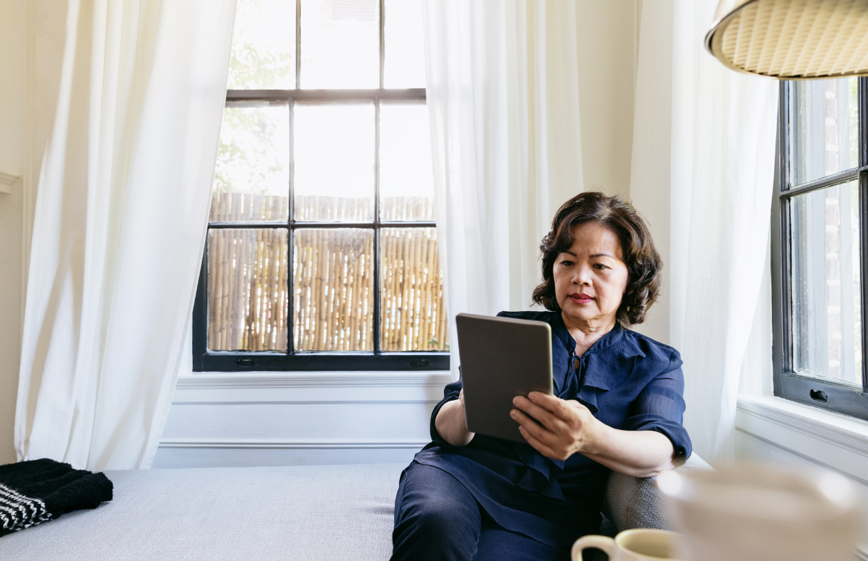 older adult woman looking at ebook