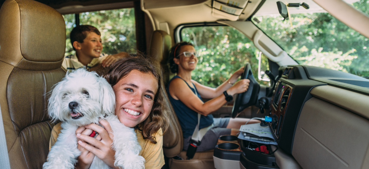family in van on road trip