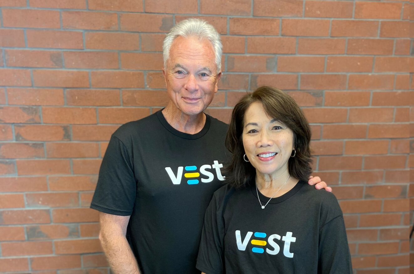 Michael Pearce and wife Sue, wearing T-shirts with Vest logo.