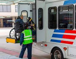 Wheelchair being lifted onto disability-services bus