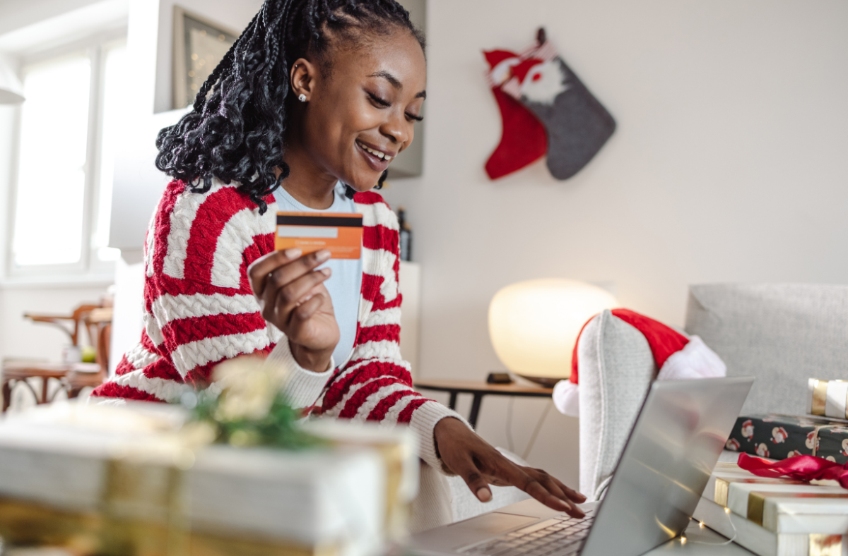 woman online Christmas shopping on laptop