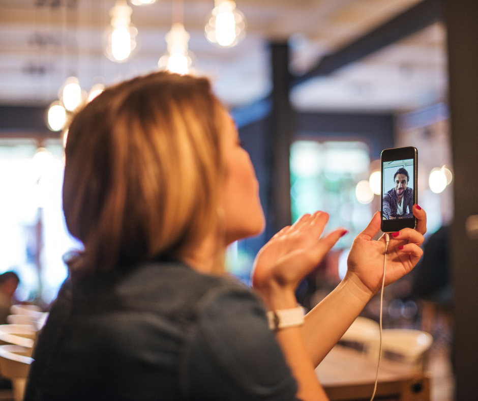 woman in office on factime with male friend