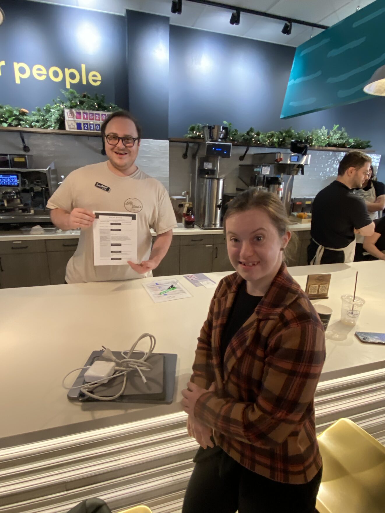 young adult girl with down syndrome in a coffee shop