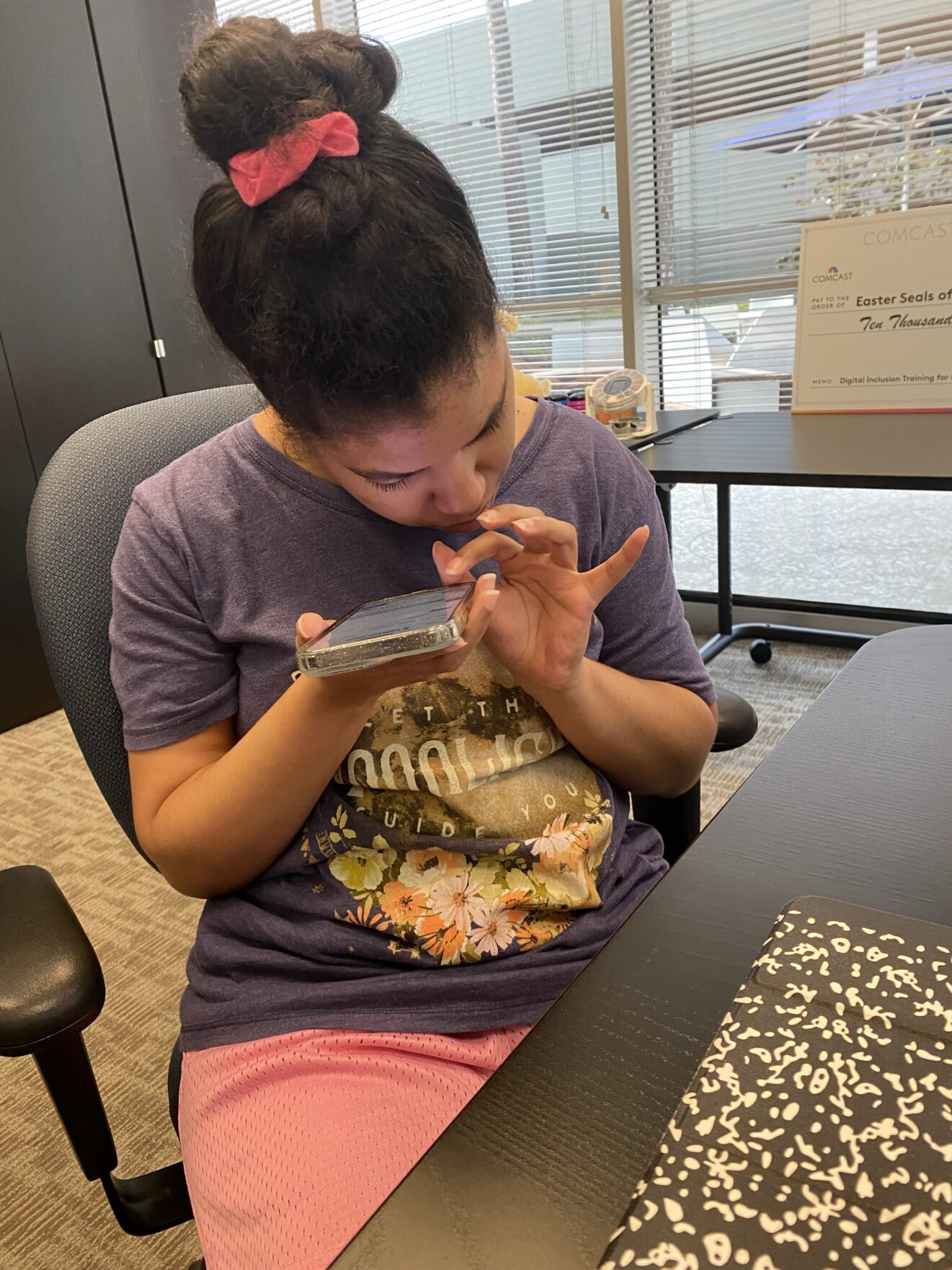 Malissa using a smartphone in AT lab