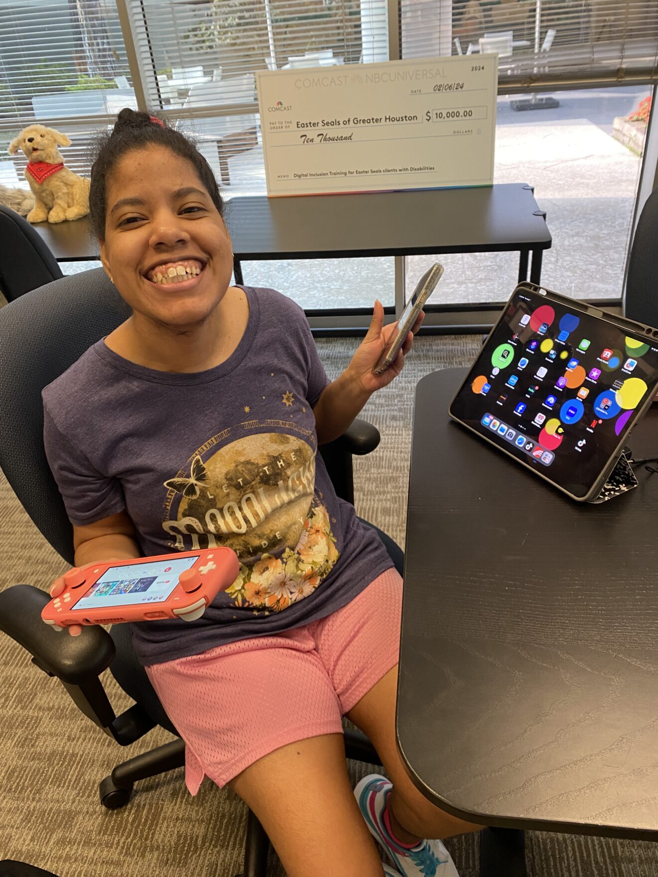 Malissa in AT lab, displaying two device screens