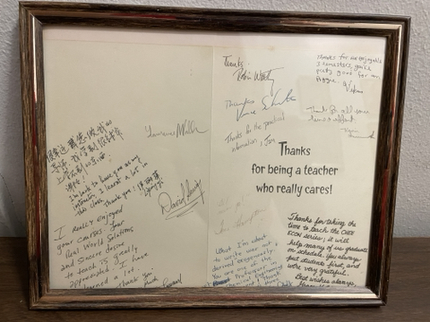 Inside of card ("Thanks for being a teacher who really cares!") that Dad received from one of his U of H classes. About a dozen students signed it, including sentiments such as "I REALLY enjoyed your courses," "Thanks for taking the time to teach," and "You're pretty good for an Aggie."