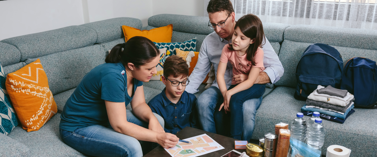 family gathered in living room preparing for emergency
