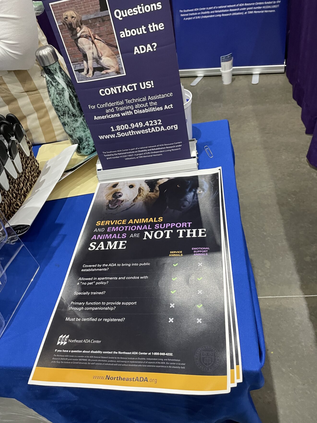 Table with handouts explaining the differences between service and emotional support animals.