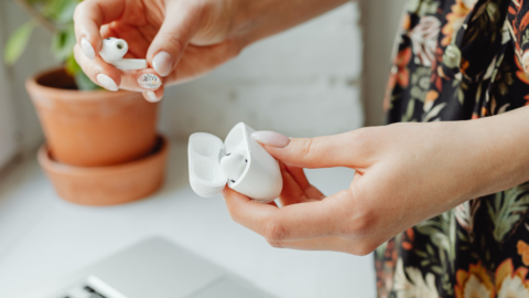 hands holding airpods