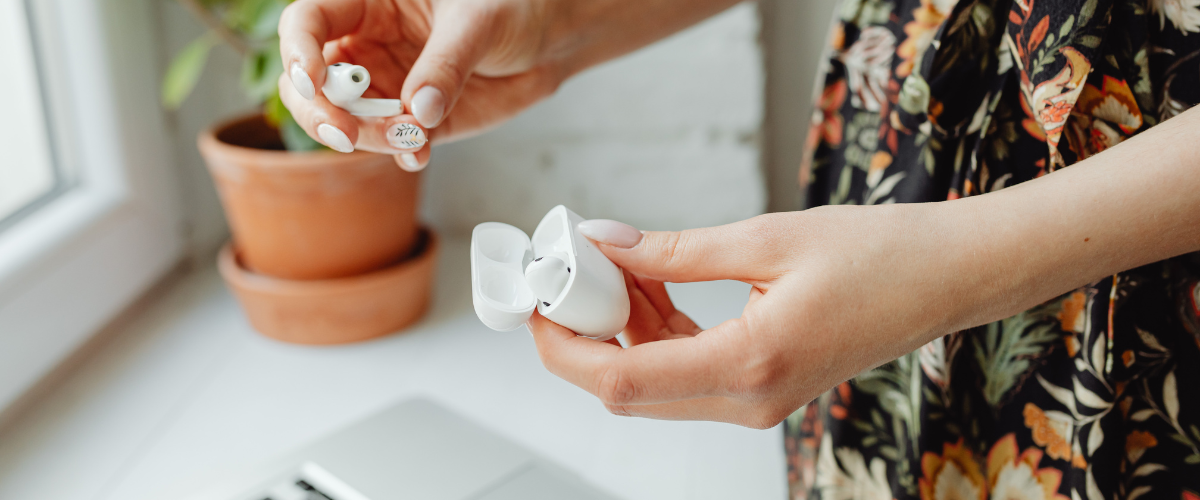 hands holding airpods