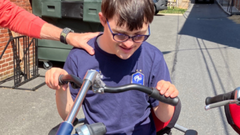 young man with down syndrome on adaptable bike
