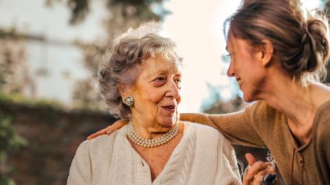 caregiver assisting older adult female