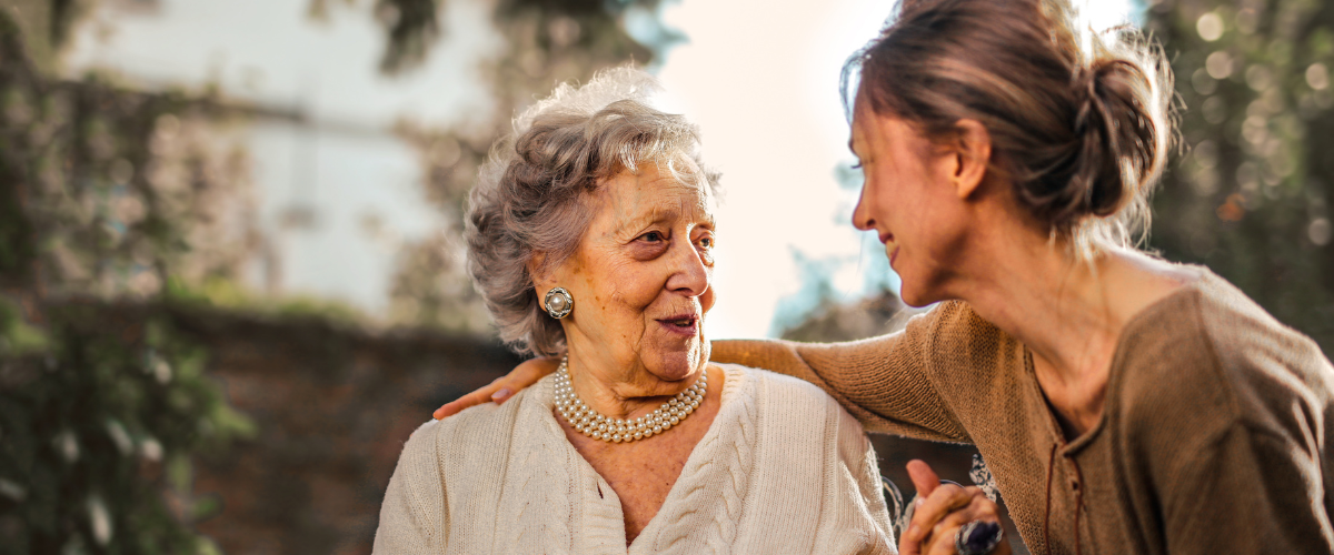 caregiver assisting older adult female