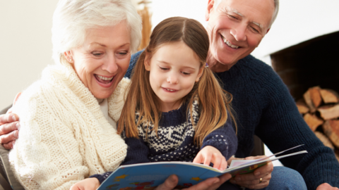 grandparents reading to 2 children