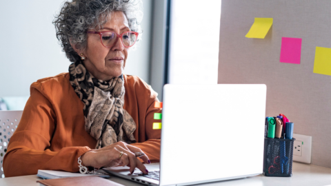 older adult woman using laptop