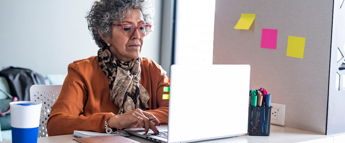 older adult woman using laptop