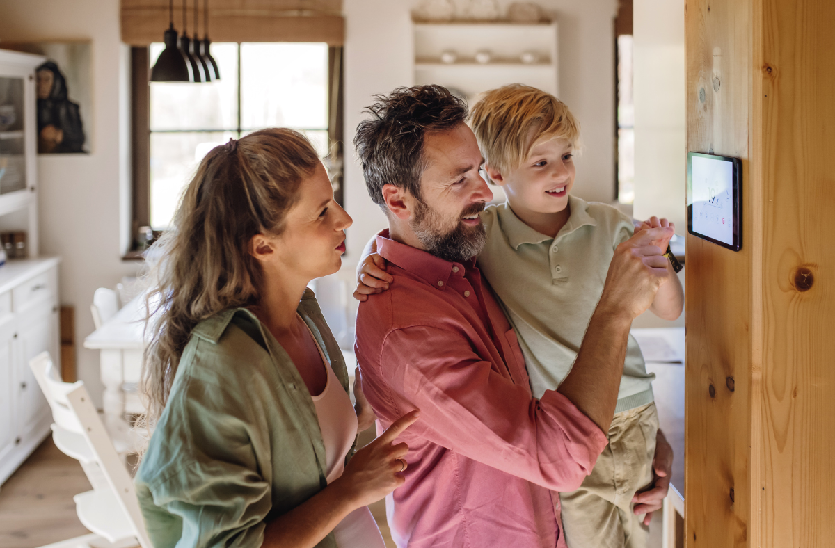 family using touch screen on wall