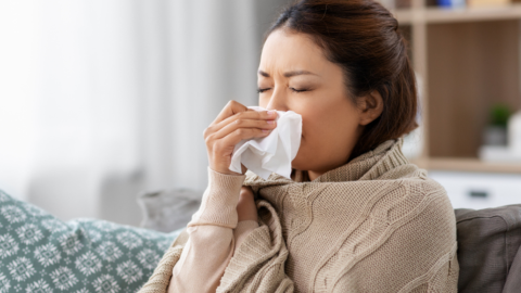 woman blowing nose