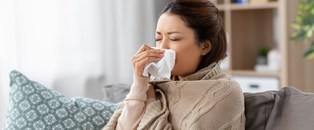 woman blowing nose
